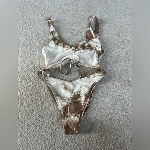 Frankie’s bikinis cut out one piece